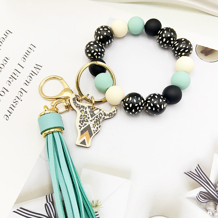 Wholesale Wooden Ox Head Sesame Spotted Wooden Beads PU Tassel Wrist Keychain